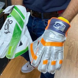 Keeper Gaurav trying out new match gloves at Dummer